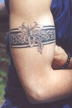 a man with a tattoo on his arm