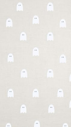 a white fabric with ghost faces on it