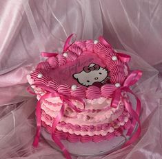 a hello kitty birthday cake with pink icing