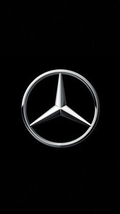 the mercedes logo on a black background