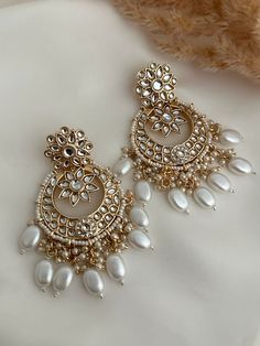 kundan  work classic chandbali statement earrings.  Lightweight  Dimensions- Earrings length- 3 inches  Style tip- Pair it with any beautiful traditional outfits  and flaunt with Unique style of collection from us. Perfect match for Festival and Traditional wear.  Take Care Tips-  Kee away from perfume, Hair spray and. Moisture.  Store in dry place , Ziplock bag or Airtight box.    Clean with dry cloth.  Jewellery is the last thing you should wear and first thing you should remove.  ------------ Luxury Traditional Kundan Jhumkas, Luxury Elegant Earrings With Mirror Work, Luxury Traditional Chandbalis With Mirror Work, Bollywood Style Earrings For Navratri, Indian Bridesmaids Earrings, Luxury Mirror Work Jewelry For Diwali, Festive Kundan Chandelier Earrings With Mirror Work, Kundan Chandbali Earrings With Gota Work, Bollywood Chandbali Bridal Earrings With Mirror Work