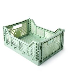 an empty green plastic crate on a white background