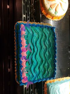 there are two cakes that have been decorated with icing on the top and bottom