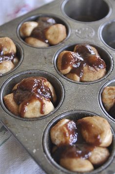 a muffin tin filled with mini cinnamon buns