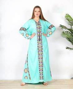 "This bohemian embroidery dress is a an eye catcher! It is an extremely comfortable wear, light and soft and can be used on many occasions - home gatherings, festival parties, summer occasions, dinners, or just in your home to feel comfortable. Fabric: 80% Egyptian Cotton; 20% Polyester. Size: one size Length : 59 inches For your reference, the model is 5'4\" and a size Small 4 on the US scale. She is wearing a size XL in this dress and that's why it's pretty loose on her. >> Shipping times<< We ship all orders with DHL or UPS Express within one to two business days. Delivery times to the USA and Europe are 3 to 5 days from the date of shipping. On average, you should receive your order within 4 to 7 days from the day you place the order. >> Refunds, returns, and exchanges<< We provide ful Green Embroidered Kaftan For Eid, Green Embroidered V-neck Kaftan, Bohemian Embroidered Thobe For Eid, Bohemian Thobe With Intricate Embroidery For Eid, Bohemian Green V-neck Abaya, Bohemian Abaya With Embroidered Border For Eid, Bohemian Maxi Length Green Abaya, Green Bohemian Embroidered Maxi Dress, Spring Green Bohemian Abaya