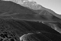 black and white photograph of mountains in the desert