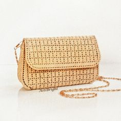 This small straw bag is a handmade evening clutch for women for any occasion: holiday, evening, wedding, going out. The natural straw bag will make you image complete. The mini shoulder purse is handmade using the technique of weaving on plastic canvas. It has a tight frame, keeps its shape well. SIZE: - SMALL - length 18cm/7 in, height 11cm/4 in, width 5.5cm/2 in - MEDIUM - length 23cm/9 in, height 14cm/5.5 in, width 6cm/2.3 in - LARGE - length 27cm/10.5 in, height 16.5cm/6.5 in, width 6.5cm/2.5 in DETAILS: - thread is 100% raffia - removable chain handle: 118cm/46 in - color - beige - 100% silk lining (sewn by an invisible stitch manually) with inside pocket - magnetic button - item comes in a packing bag. NOTE! The lining pattern and chain pattern may differ from photo. Washing instruct Rectangular Straw Shoulder Bag For Evening, Elegant Summer Clutch Bag, Elegant Handmade Natural Clutch, Chic Evening Straw Bag In Rectangular Shape, Chic Rectangular Evening Straw Bag, Chic Evening Rectangular Straw Bag, Elegant Beige Woven Clutch, Elegant Natural Color Clutch Evening Bag, Chic Gold Evening Bag For Summer