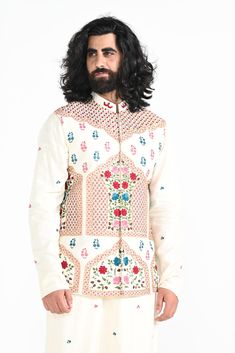 Ivory floral hand embroidered nehru jacket with intricate details on Linen Satin. Paired with Ivory slim fit Pant Pajama. Color of the actual garment may vary due to lighting conditions during the shoot.

Size Chart For Men





	
	
					Men's Size Chart
		

		
		
						
				Size Chart For Men
				Custom Size Measurement Guide
			
			
				
				
				Custom Size Measurement Guide
1. Take your measurements at ease…don’t hold your breath!
2. Be a little generous with the measurements. It’s always ea Cream Nehru Jacket With Cutdana For Transitional Season, White Nehru Jacket For Diwali Reception, White Nehru Jacket For Reception Diwali, Traditional Sherwani With Intricate Embroidery For Spring, Off White Nehru Jacket With Zari Work For Reception, Off White Nehru Jacket With Zari Work, Fitted White Nehru Jacket With Zari Work, White Fitted Nehru Jacket With Zari Work, White Sherwani With Zari Work For Spring