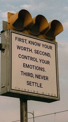 a traffic light with a sign that says, first, know your worth second, control your emotions third, never setle