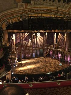 an empty stage with people sitting on it