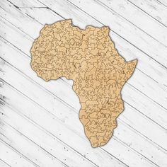 a wooden africa map with animals on it