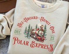 Polar Express Shirt, Christmas Gift for Family,  Xmas Crewneck Sweat, Merry Christmas Hoodie, Gift Ideas, All Aboard Polar Express s92. A stylish and comfortable shirt that's perfect for any occasion. This shirt features a classic design, high-quality fabric, and a tailored fit to ensure you look your best. Whether you're dressing up for a special event or keeping it casual, this shirt is a versatile addition to your wardrobe. Elevate your fashion game with this must-have piece. #christmas gift Christmas Gift For Family, Christmas T Shirt Design, Polar Express, Christmas Hoodie, Vinyl Print, Family Christmas Gifts, All Aboard, Christmas Hoodies, Mens Long Sleeve Tee