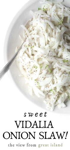 a white bowl filled with onions on top of a table