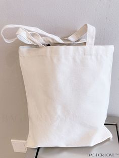 BagForLove - Chic Canvas Tote Bag with Minimalist Design Product Description Color White Strap Type Double Handle Bag Size Medium Pattern Type Plain Type Shopper Bag Style Unisex Material Fabric Composition 100% Polyester Size Chart INCH CM Bag Length Bag Width Bag Height Handle Height 13.8 inch 0.4 inch 15.7 inch 9.4 inch Bag Length Bag Width Bag Height Handle Height 35 cm 1 cm 40 cm 24 cm Details Pictures Similar Products h2 { text-align: center; } /* æ¢è¡ */ li{ white-space: normal; word-br Simple White Canvas Tote Bag, Simple White Canvas Bag For Everyday Use, Simple White Canvas Bag For Everyday, Simple White Canvas Everyday Bag, Simple White Bag With Large Capacity, Simple White Large Capacity Bag, Simple Large Capacity White Bag, Simple White Everyday Bags, White Bags For Everyday