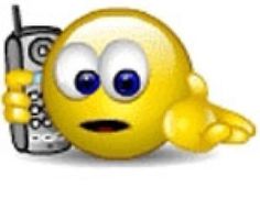 an emoticive smiley face holding a cell phone