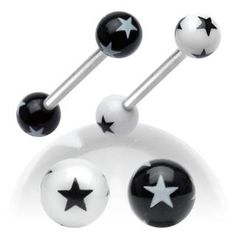 three black and white balls with stars on them