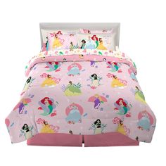 a pink bed with princesses on it