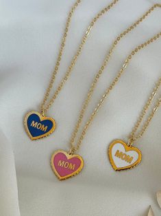 The Word Mom on a heart shape filled with colorful enamel on a beautiful handmade necklace ♥  18k Gold plated  -------------------------- ◦Gift idea suitable for every occasion (Birthday / Anniversary/ Mother's day/ Teacher's day /Christmas) ◦Necklace length 40 cm with 3 cm extra extension ◦Handmade with care and love Product Specifications: ✓Adjustable ✓High quality ✓Handmade ✓Long lasting ✓Unique gift idea All our Products are handmade with care using high quality materials and fine finishing White Charm Necklace For Mom Valentine's Gift, White Charm Necklace For Mom On Valentine's Day, Multicolor Jewelry Gift For Mom, Trendy Personalized Jewelry For Valentine's Day, Multicolor Charm Necklace For Gift, Trendy Heart Necklace For Mother's Day, Cute Clavicle Chain Necklace For Mother's Day, Trendy Pendant Necklaces For Mother's Day, Cute Jewelry Gift For Mother's Day