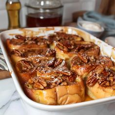 a casserole dish filled with bread and nuts