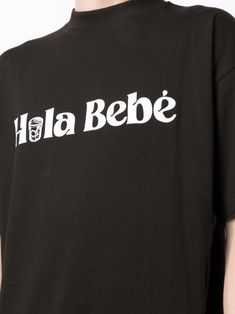 Hola Bebé organic-cotton T-shirt from BLUE SKY INN featuring black, organic cotton, slogan print to the front, round neck, short sleeves and straight hem. This item is made from at least 50% organic materials.. Learn more about what makes a product Conscious on our Conscious Criteria page. Size Info STANDARD Color Detail Black Made In Italy Material 100% Cotton Season One Fall-Winter Season Two Fall-Winter Product t-shirts and polos Brand Blue Sky Inn Size And Fit This piece fits true to size. W Black Organic Cotton T-shirt For Streetwear, Basic Organic Cotton T-shirt With Graphic Print, Organic Cotton Short Sleeve T-shirt With Letter Print, Organic Cotton Short Sleeve T-shirt With Logo, Organic Cotton T-shirt With Logo For Streetwear, Organic Cotton Logo Print T-shirt With Short Sleeves, Organic Cotton Logo Print T-shirt For Streetwear, Basic Organic Cotton T-shirt With Logo Print, Organic Cotton Crew Neck T-shirt With Logo Print