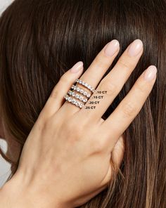 a woman's hand with three rings on her finger and the words, not to touch that ring