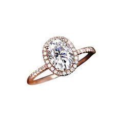 an oval shaped diamond ring set in 18k rose gold with diamonds surrounding the band