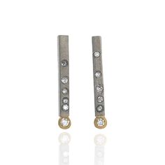 Gold & Stone Earrings - Five flush-set diamonds punctuate the slender bar on these simple yet stunning drop earrings. An 18k gold tube setting cradles a single diamond at the end, adding a touch of contrast to the linear design. 18k gold posts.<br><br>Available in oxidized sterling silver, 18k yellow gold, and 18k white gold.<br><br>Diamonds: 0.15tcw Anniversary Linear Drop Earrings With Single Cut Diamonds, Gold Stone Earrings, Tube Setting, Flush Set Diamond, Night Bar, Gold Bar Earrings, Linear Design, Gold Stone, Bar Earrings