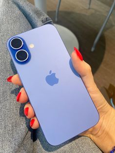 a woman's hand holding an iphone case with two buttons on the front and back