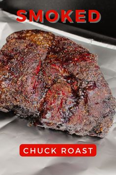 there is a piece of meat that has been grilled on the grill and it says smoked chuck roast