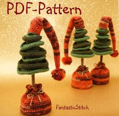 three knitted christmas trees on top of each other