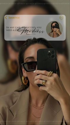 a woman taking a selfie with her cell phone in front of her face and wearing sunglasses