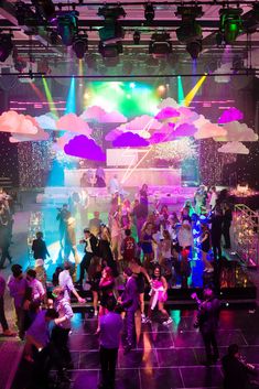 a group of people standing on top of a dance floor