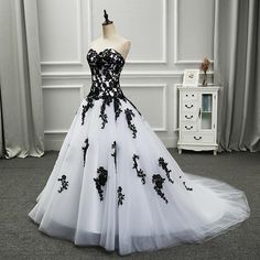 a black and white wedding dress on display