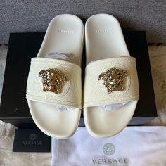 New Versace Medusa Palazzo Slides White 40/ Us 10 Rubber Pool Slides Embellished With A Three-Dimensional Medusa Plaque Surrounded By A Greca Accent. Embellishment Three-Dimensional Medusa Plaque Material Rubber Design Pool Slides Accent Greca Surrounding The Plaque Color White 100% Brand New Authentic Guaranteed Professional Business Cross-Platform Seller For Luxury Resale Since 2013 Feel Free To Check Out My Positive Selling History. Shop With Confidence. No Trades Or Low Ball Offers. Luxury Formal Flat Slides, Luxury Embellished Summer Sandals, Luxury Slides For Formal Summer Events, Luxury Formal Slides For Summer, Designer White Embellished Sandals, Designer Summer Slides With Removable Insole, Luxury Flat Heel Slides For Beach, Elegant White Flat Slides, Designer Beach Slides With Flat Heel