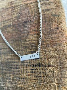 Gorgeous 25mm hand stamped plaque mounted on silver plated necklace. Please pop in notes or drop me a message with your Angel numbers!x Silver Hand Stamped Necklace For Birthday Gift, Silver Hand Stamped Nameplate Necklace, Silver Laser Engraved Charm Necklaces For Anniversary, Silver Laser Engraved Charm Necklace For Anniversary, Silver Stamped Charm Necklace For Birthday, Silver Stamped Nameplate Necklace, Silver Stamped Necklace For Birthday, Silver Dog Tag Necklace With Name, Angel Numbers 111