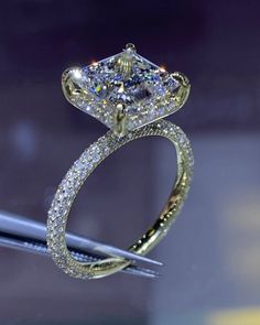 a diamond ring is shown on display in a store