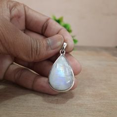 This Moonstone Silver Pendant with a dainty chain is an absolute stunner. The enchanting moonstone glimmers with a mystical allure, while the silver setting adds a touch of sophistication. It's the perfect accessory to add a touch of magic to any outfit! ✨🌙 Makes a Wonderful Gift for your Girlfriend, Wife, Mom or Simply an Excellent Addition to Your Jewelry Collection. Comes in a FREE GIFT BOX ●Product Details:- *Product Type - Pendant Necklace *Metal              - Sterling Silver *Stamp             - 925 *Gemstone      - Moonstone *Gemstone Color - Blue *Gemstone Cut - Cabochon  *Gemstone Treatment- Natural (No Treatment) *Gemstone Shape- Pear *Product Weight - 8.60gm Approximate  ●Quality:- >>Each piece is crafted by hand, ensuring that it is made with care and attention to detail. The White Moonstone Jewelry With Moon Charm, White Mystical Pendant Jewelry, Mystical White Pendant Jewelry, White Moon-shaped Gemstone Jewelry, Mystical Moonstone Jewelry With Large Stone, White Moonstone Gemstones As Gift, White Moonstone Gemstones For Gift, White Moonstone Gemstones With Spiritual Style, White Moon-shaped Jewelry With Natural Stones