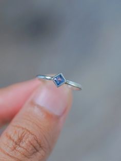 Simple, but not quite ordinary. Subtle, but not quite average. Here's a square sapphire ring to harness clear thoughts and focus in your day-to-day life. Each piece of our jewelry is handcrafted with love. Blue Square Cut Sapphire Promise Ring, Rectangular Sapphire Promise Ring In Sterling Silver, Square Cut Blue Sapphire Promise Ring, Square Cut Sapphire Ring For Gift, Square Cut Sapphire Ring As Gift, Square Cut Sapphire Promise Ring, Sapphire Square Cut Gemstone Ring, Sterling Silver Square Cut Sapphire Promise Ring, Rectangular Sapphire Ring In Sterling Silver