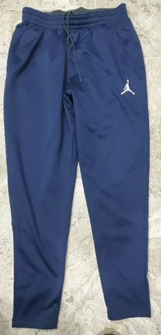 RARE NEW SAMPLE Nike Jordan 360 Team Basketball Sweatpant 865866-419 Youth Large. ONLY MODEL SWEATPANTS IN THIS STYLE AND SIZE FOR SALE ON EBAY!!! Awesome 2017 Nike Therma Fit SAMPLE Air Jordan 360 sweatpants in youth size large. Great look with pockets and a drawstring in a dark blue colorway. I love the Air Jordan logo even on the drawstrings. Please review all pictures. These sweatpants retailed in excess of $85. Here's your chance to obtain a great item that is no longer made! Your child wil Nike Sporty Navy Pants, Air Jordan Logo, Nike Therma Fit, Jordan Logo, Stylish Pants, Nike Jordan, Parachute Pants, Air Jordan, Air Jordans