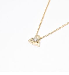 Diamond Triangle Necklace set with Natural Diamond, size 3 millimetres diameter, 0.12 Carats. Solid 14k Yellow Gold ☞ made to last. Click here for ☞ Solid Gold Collection Diamond Details: • CERTIFIED Natural Diamond • Weight: 0.12 Carats • Dimensions: 3mm • Color: G • Clarity: I1 • Cut: Very Good • Fluorescence: Yes Solid Gold Details: • 2 grams of 14k Solid Yellow Gold • Dimensions: Length ≈ 16in to 18in • Lasts a lifetime - Perfect for everyday use (won’t tarnish) *Final weight & dimensions de Minimalist Gold Necklace, Minimalist Necklace Gold, Gold Letter Necklace, Triangle Necklace, Triangle Pendant, 14k Gold Necklace, Solid Gold Jewelry, Silver Gifts, Gold Collection