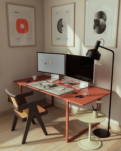 a computer desk with two monitors and a laptop on it in front of three pictures