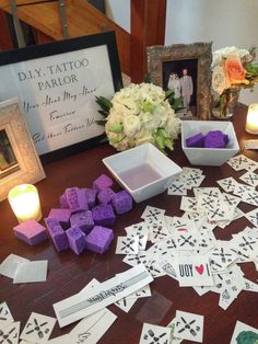 a table topped with lots of cards and candles