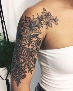 a woman's arm with flowers on it