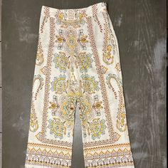 Zara Light Tan Beige Pants With Light Blue, Yellow, Burnt Orange, Khaki Green Paisley Print Pattern. Wide Leg, Side Zipper. New With Tags Ladies Xs Measures 14.5 Inches Across Waist 11 Inches Across Pant Bottom 29 Inch Inseam 40.5 Inches Top To Bottom Length Material 55% Linen, 45% Cotton Summer Wide-leg Paisley Print Pants, Spring Wide-leg Pants With Paisley Print, Spring Wide Leg Bottoms With Paisley Print, Wide Leg Bottoms With Paisley Print For Spring, Wide Leg Paisley Print Bottoms For Spring, Patterned Bottoms With Boho Print For Spring, Paisley Print Trousers For Spring, Spring Patterned Bottoms With Paisley Print, Patterned Printed Straight Pants