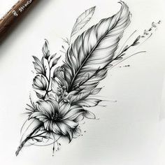 an ink drawing of a feather and flowers on paper with a pen next to it