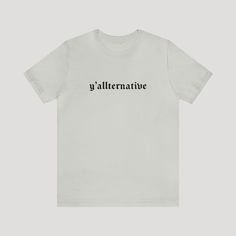 🖤 Blend Southern Charm with Goth Style in Our 'Yallternative' T-Shirt 🖤 Introducing the perfect fusion of Southern roots and gothic flair - 'Yallternative' Gothic T-Shirt. Designed for those who walk the line between country charm and dark elegance, this t-shirt features the word "Yallternative" in a captivating gothic font. It's more than just a tee; it's a fashion statement for the unorthodox. Why You'll Love This Tee: Unique 'Yallternative' Design: Embrace your alternative side with a gothic twist, ideal for those who defy the norm. Premium Quality: Made from 100% Airlume combed and ringspun cotton, it offers a soft, comfortable experience. Lightweight and Durable: At 4.2 oz/yd² (142 g/m²), this tee is perfect for daily wear without compromising on quality. Unisex Fit: A retail fit th Country Vibes, Gothic Font, Dark Spirit, Dark Elegance, Gothic Fonts, Walk The Line, Goth Style, Country Charm, Southern Charm