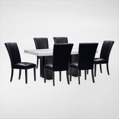 a dining table and chairs are shown with black leather upholstered backrests