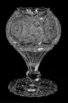 a clear glass vase sitting on top of a table