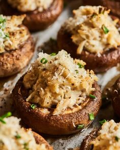 stuffed mushrooms with cheese and chives on top