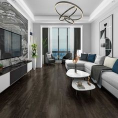 a living room filled with furniture and a flat screen tv on top of a wooden floor